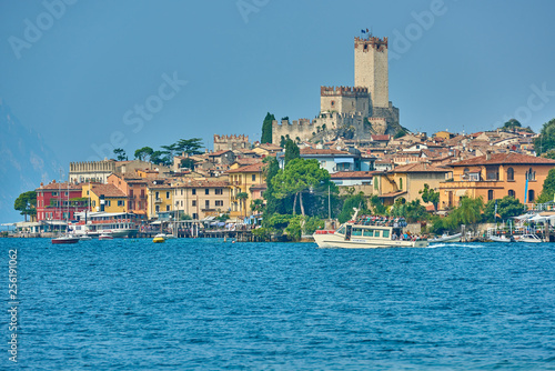 Malcesine,Lago di Garda ,Italy - 13 October 2018: View of the beautiful Lake Garda in Veneto region, Malcesine town and old castle on rock in the summer time, Italy