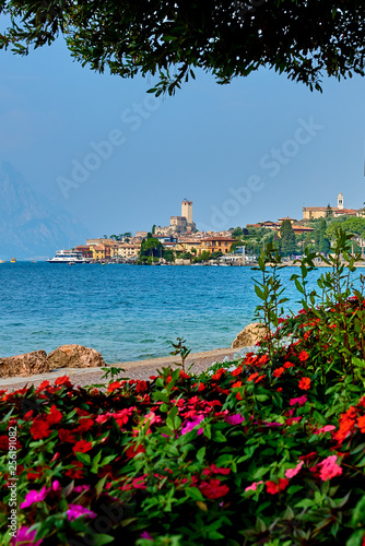 View of the beautiful Lake Garda in Veneto region, Malcesine town and old castle on rock in the summer time , Italy © DannyIacob
