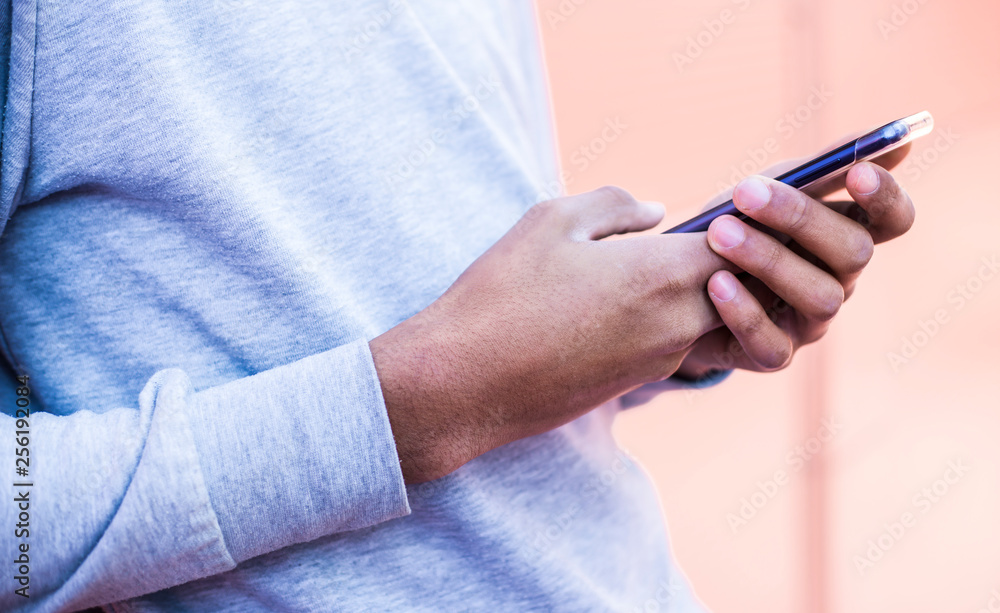 Close-up of a mobile phone in the hands of a black man. Smartphone uses. Close-up of a mobile phone in the hands of a black man. Smartphone uses.