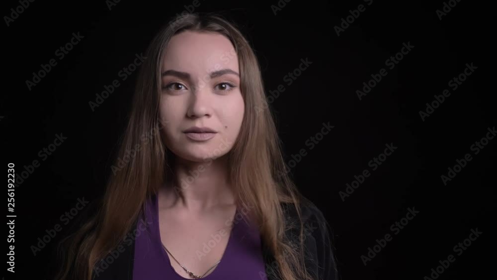 Closeup shoot of young stunning caucasian female getting surprised and excited smiling while looking at camera Closeup shoot of young stunning caucasian female getting surprised and excited smiling while looking at camera
