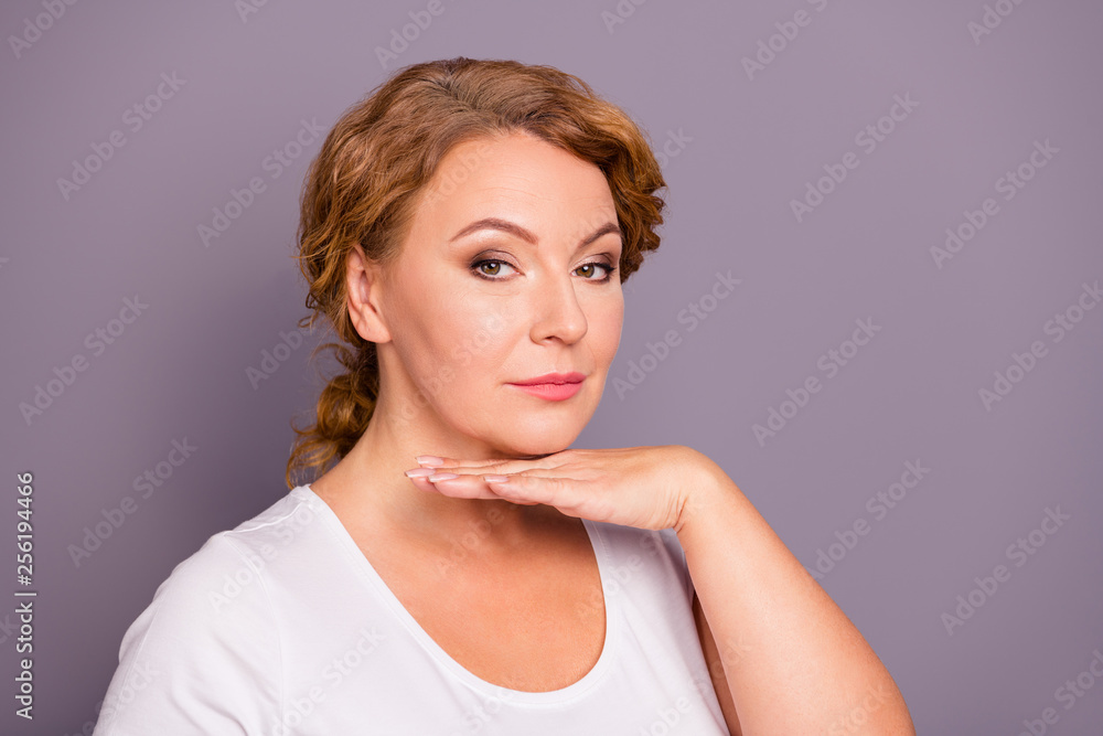 Close-up portrait of nice charming attractive content groomed wavy-haired lady wearing casual white t-shirt holding palm under chin flawless face isolated on gray violet purple pastel background Close-up portrait of nice charming attractive content groomed wavy-haired lady wearing casual white t-shirt holding palm under chin flawless face isolated on gray violet purple pastel background