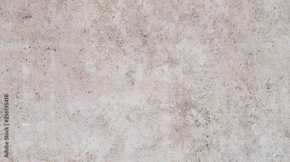 Full frame texture background of a light brown stone slab. Full frame texture background of a light brown stone slab.
