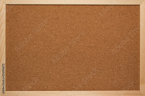 Cork board for notes in a wooden frame