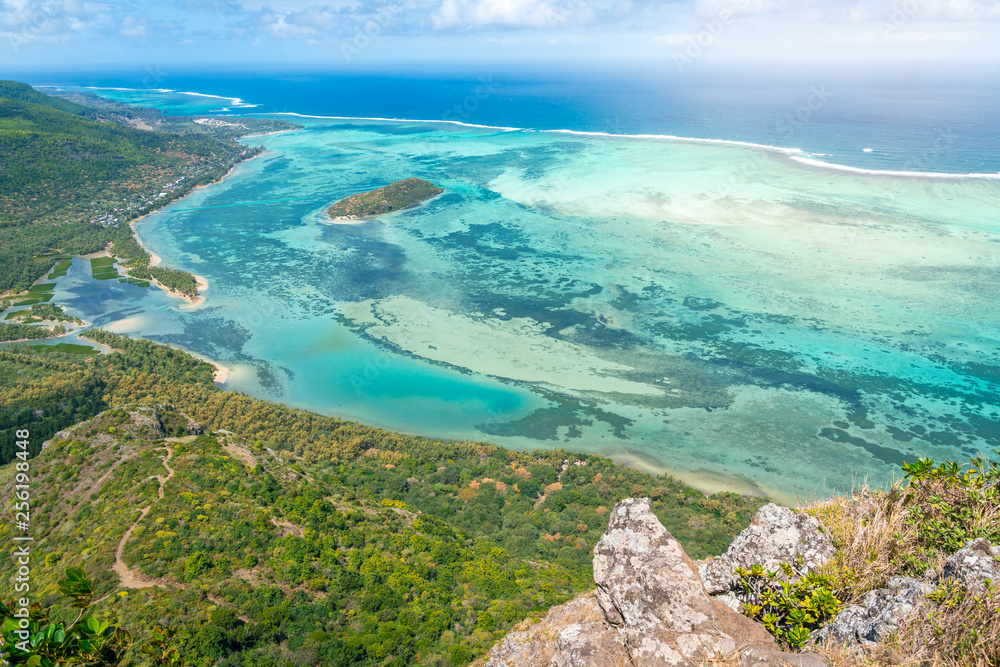 Beautiful view of a tropical beach with crystal clear water from the mountain in le Le Morne Brabant, Mauritius