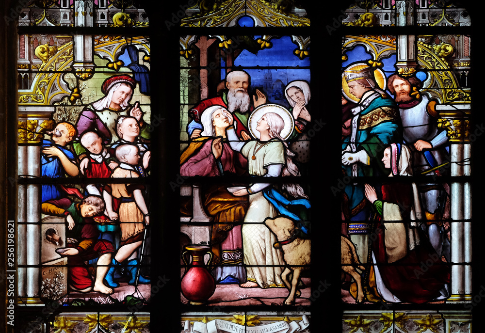 Saint Genevieve giving sight to his mother in the presence of Saint Marcel, stained glass window in Saint Severin church in Paris, France
