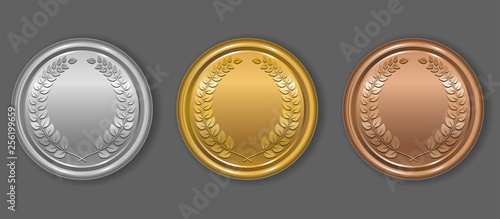 Gold, silver and bronze award medals with laurel wreath. Blank medals set. Blank of coins. Vector illustration. photo
