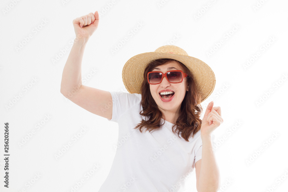 Happy surprised and excited woman in summer hat, sunglasses and template white t shirt isolated on white background. Holiday vacation with big sale. Fun summertime. Copy space, blank place on tshirt.