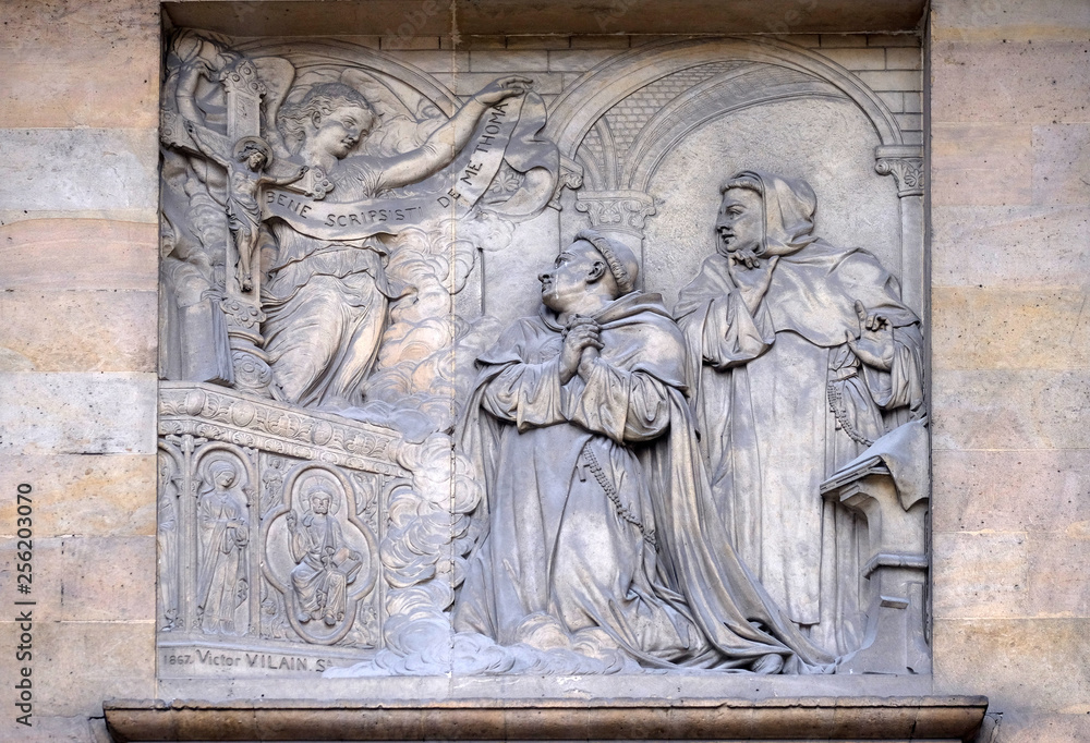 Relief on the portal of Saint Thomas Aquinas in Paris, France 