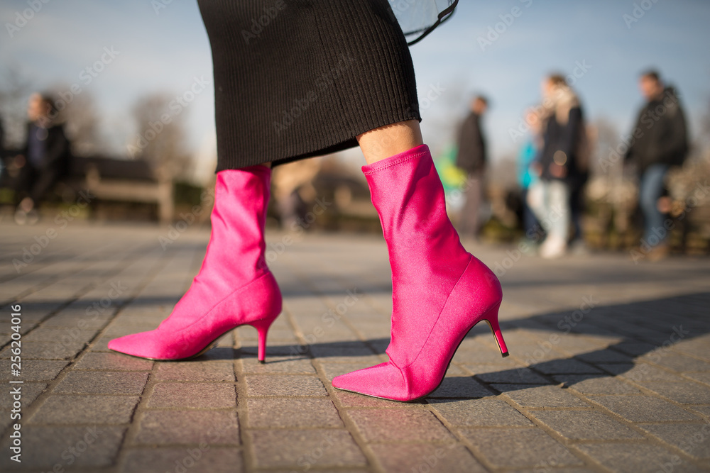 A close up shot of a young fashionable woman walking in the hot pink sock  boots. Cocnept of fashion, foortwear and street style. Spring and autumn  outfit ideas. Stock Photo | Adobe