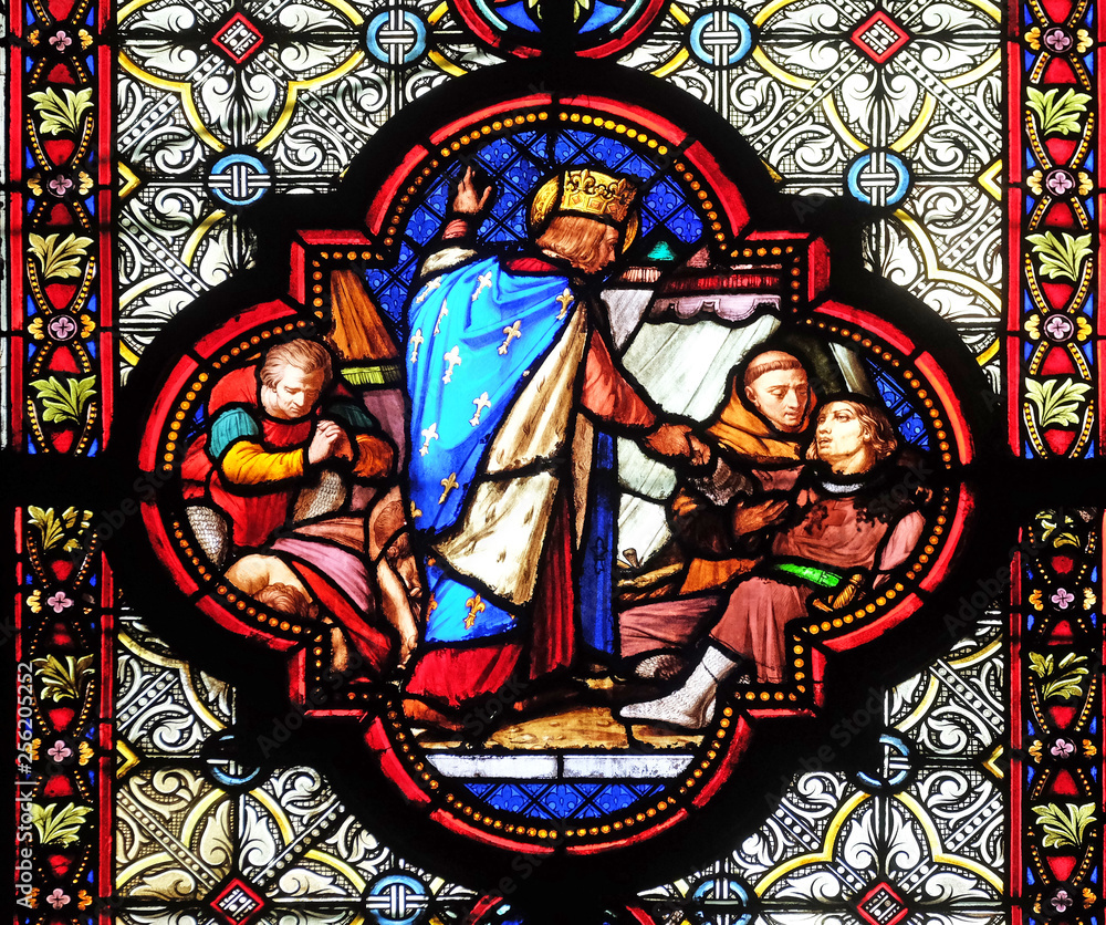 Saint Louis attending the plague victims, stained glass window in the Basilica of Saint Clotilde in Paris, France 