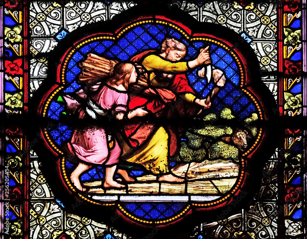 Isaac carrying the wood of the sacrife, prefiguration of the carrying of the Cross, stained glass window in the Basilica of Saint Clotilde in Paris, France