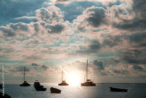 boats in the sea before sunset, beautiful silhouettes of boats