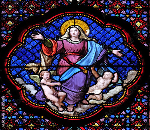 Assumption of Virgin Mary, stained glass window in the Basilica of Saint Clotilde in Paris, France 
