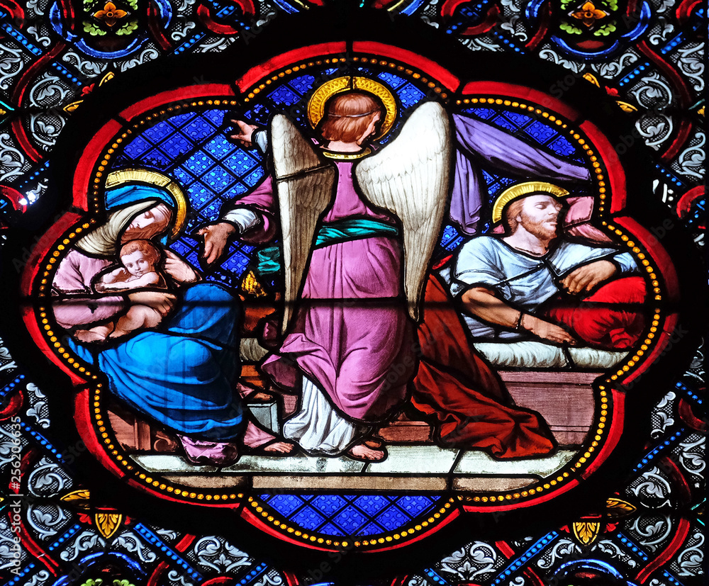 Fototapeta premium Saint Joseph's second dream, departing to Egypt, stained glass window in the Basilica of Saint Clotilde in Paris, France 