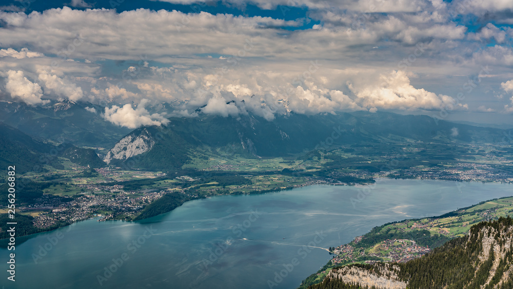 Switzerland, panoramic view on lake Thunersee and Alps from Beatenberg