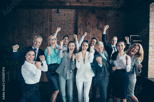 Close up photo yelling diversity different age multiethnic mixed race business people stand she her he him his best brigade hands arms raised up project got first place formalwear jackets shirts