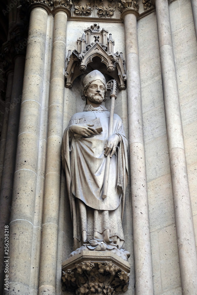Statue of Saint on the portal of the Basilica of Saint Clotilde in Paris, France 