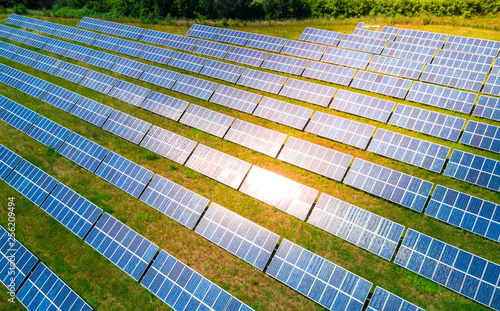 Aerial view of Solar panels Photovoltaic systems in italy, industrial pattern landscape