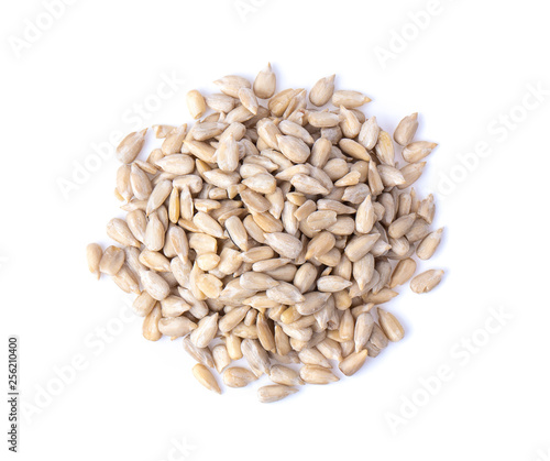 Peeled Sunflower seeds isolated on white background. Top view