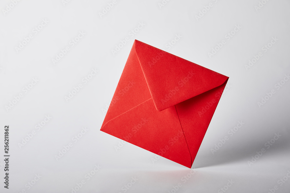 red and bright envelope on grey background with copy space red and bright envelope on grey background with copy space