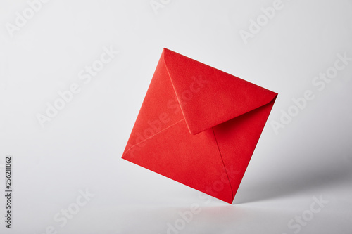 red and bright envelope on grey background with copy space