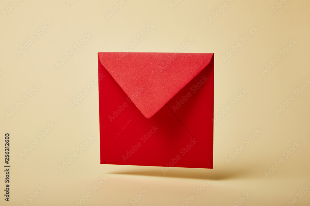 red and bright envelope on colorful and yellow background with copy space red and bright envelope on colorful and yellow background with copy space