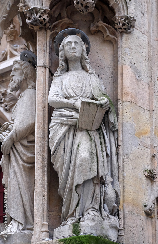 Saint John the Apostle, statue on the portal of the Saint Merri Church, Paris, France