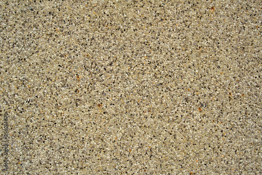 Black , white , yellow small stone bond by concrete wall background texture Black , white , yellow small stone bond by concrete wall background texture