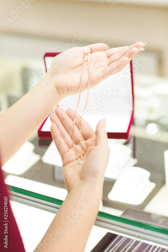 Beautiful cheerful woman at the jewelry shop