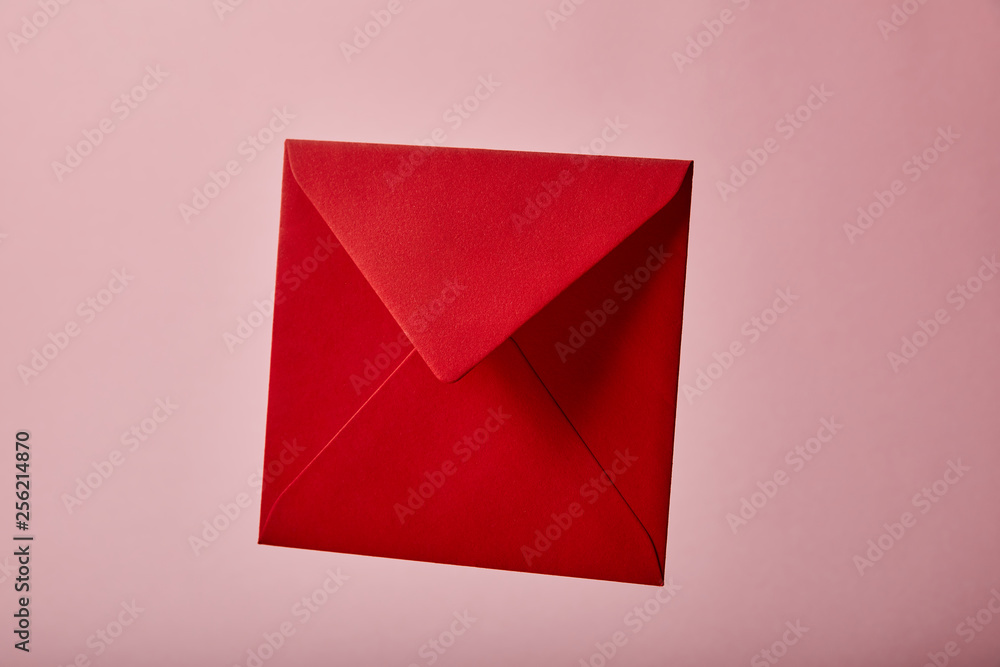 red and empty envelope on pink background with copy space red and empty envelope on pink background with copy space