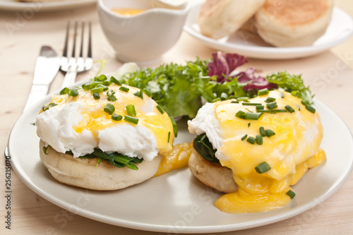 Tableau sur toile Eggs Florentine- toasted English muffins, spinach, poached eggs and  hollandaise