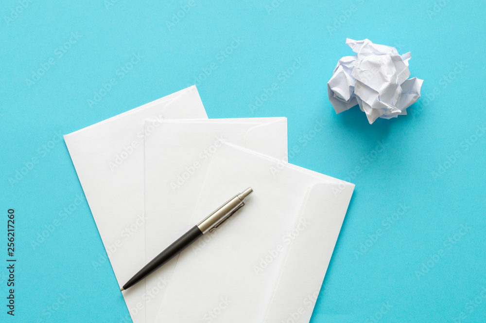 sheets of paper and crumpled wads on table sheets of paper and crumpled wads on table