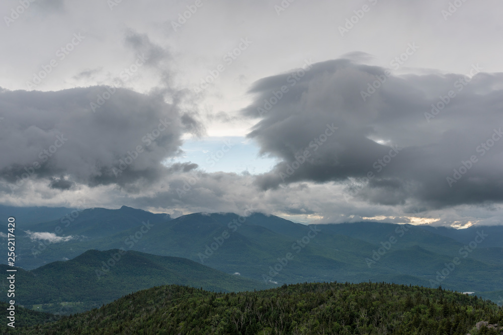 storm clouds with a peek of blue in between them