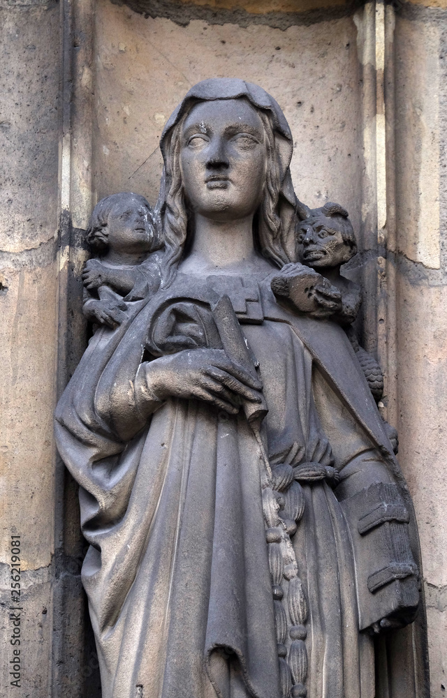 Sainte Genevieve, statue on the portal of the Saint Nicholas des Champs Church, Paris, France