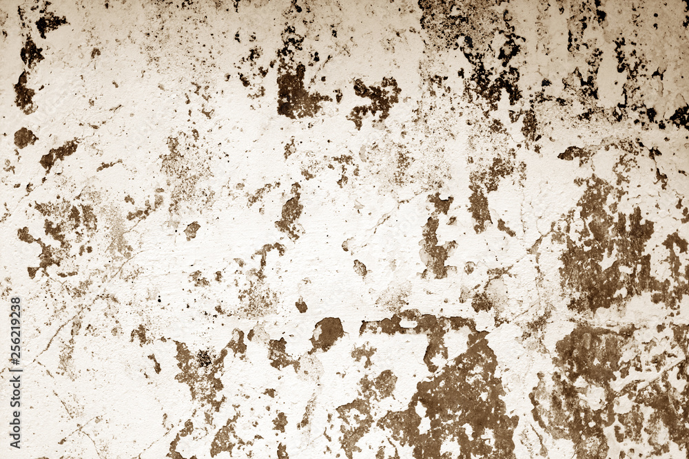 Сraked weathered cement wall texture in brown tone.