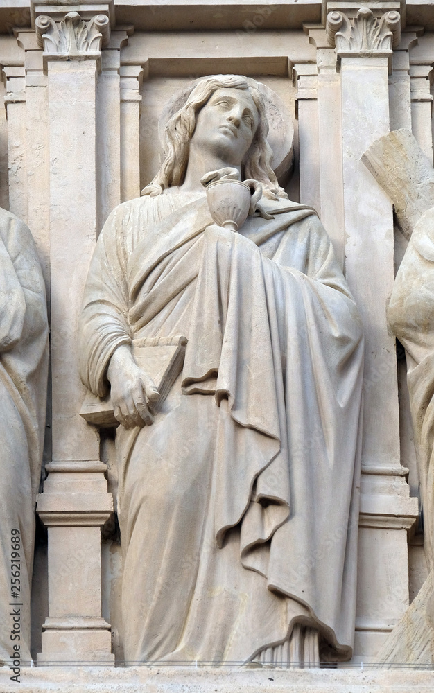 Saint John the Apostle, statue on the facade of Saint Augustine church in Paris, France 