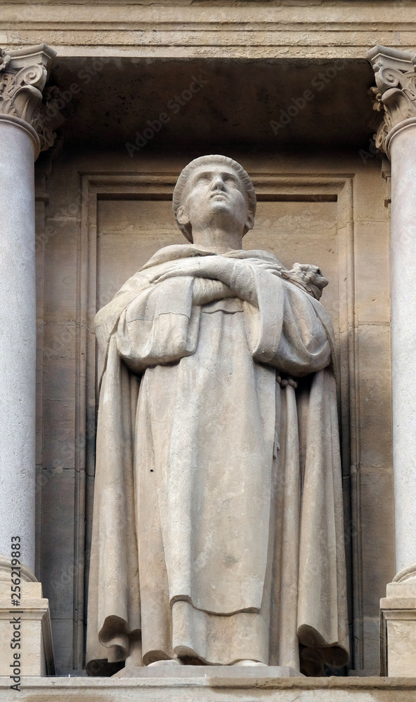 Statue of Saint on the facade of Saint Augustine church in Paris, France