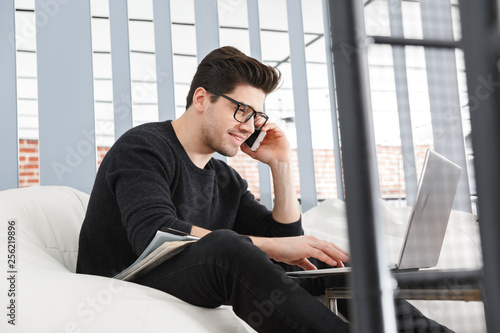 Confident young business man working at the office