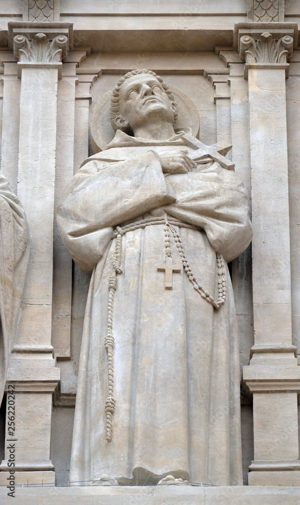 Saint Francis of Assisi, statue on the facade of Saint Augustine church in Paris, France