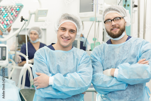 Surgical team posing in an operating theatre