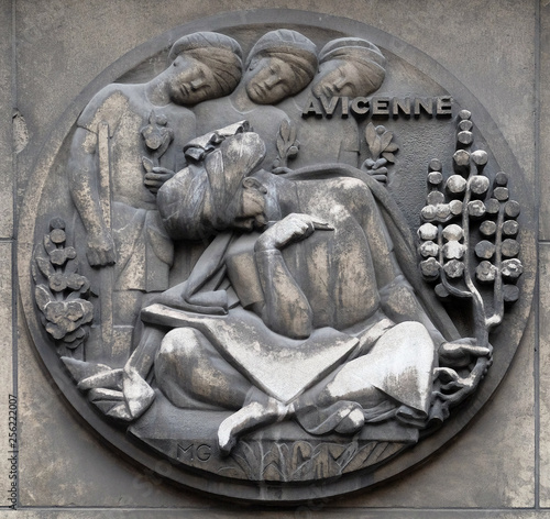 Avicenna, was a Persian polymath who is one of the most significant physicians, astronomers, described as the father of early modern medicine, relief at the building of the Faculte de Medicine Paris photo