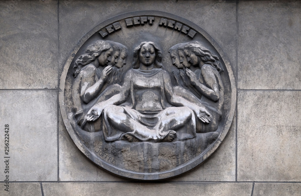 The seven mothers. Stone relief at the building of the Faculte de Medicine Paris, France 