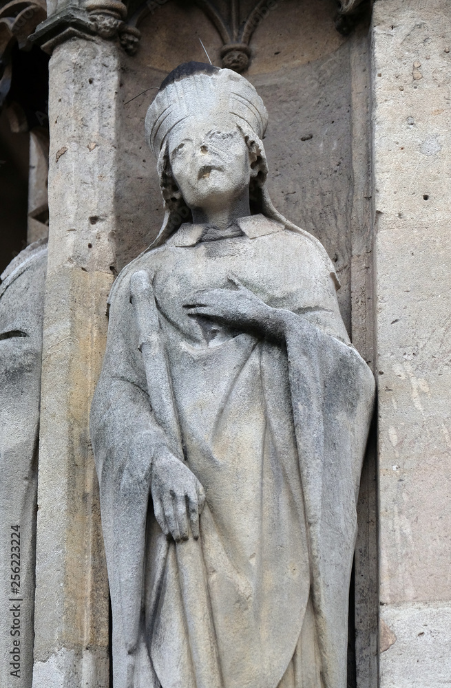 Saint Marcel statue on the portal of the Saint Germain l'Auxerrois church in Paris, France 