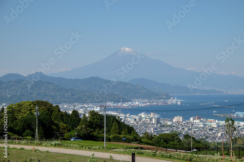 Japan city view over looking Mt. Fuji and the sea.