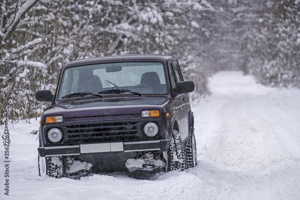 off-road vehicle on a snowy road off-road vehicle on a snowy road