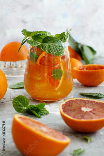 Homemade refreshing drink with bloody orange juice and mint