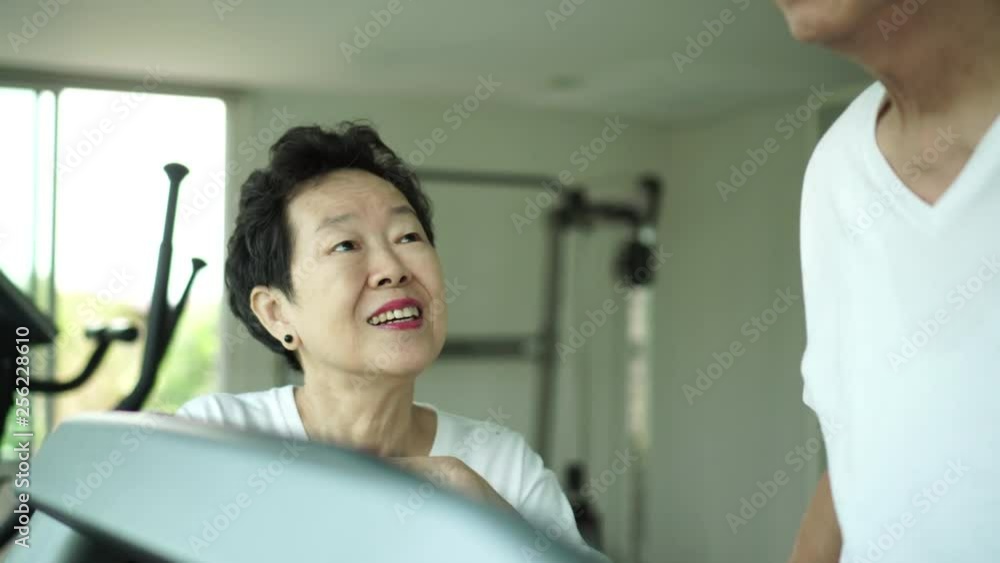 Asian elderly couple encourage partner to exercise Asian elderly couple encourage partner to exercise
