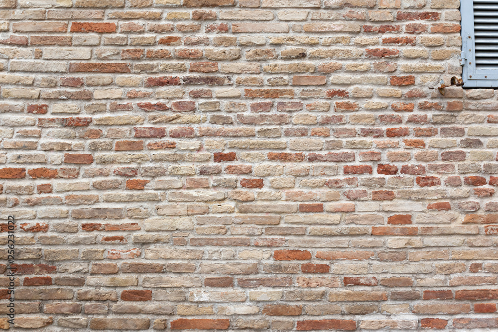 Naklejka premium typical red brick wall background texture