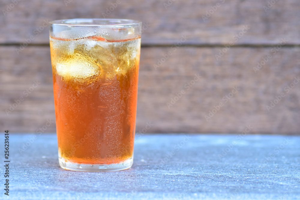 iced tea on blur wood background iced tea on blur wood background