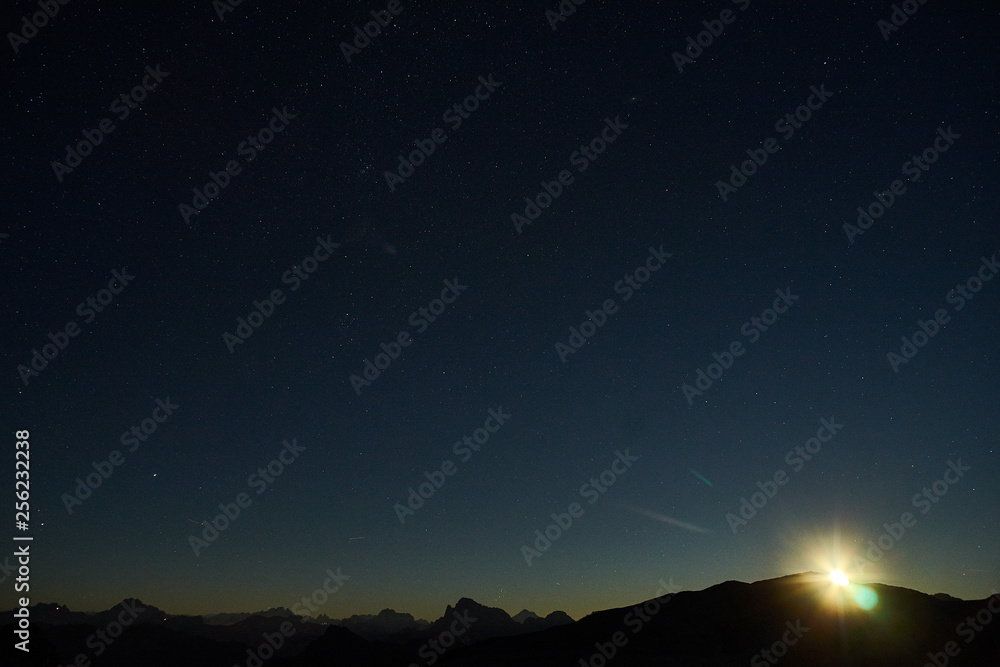 Moonrise and starry sky on Altipiano delle Pale di San Martino di Castrozza, Primiero, Dolomiti.